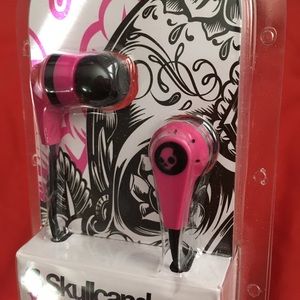 Skullcandy pink and black earbuds.